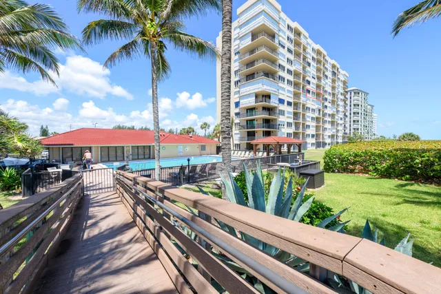 a view of a balcony with wooden floor