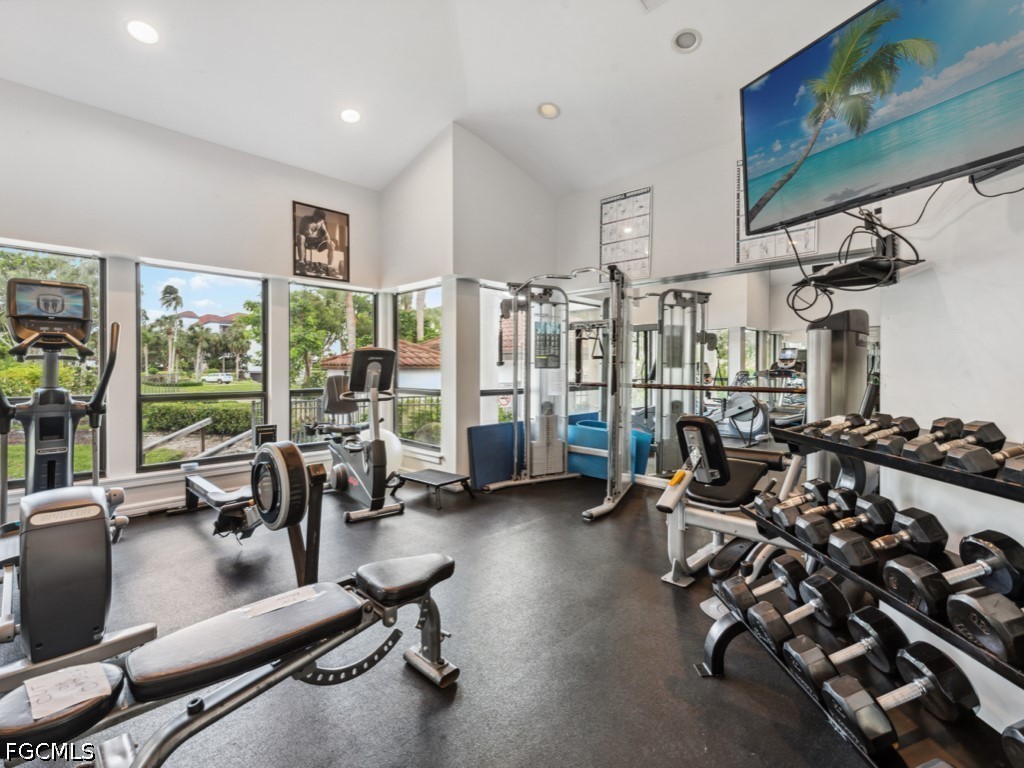 232 La Peninsula Boulevard, Unit 232 Naples, FL 34113 - Photo 44 of 44 a view of a room with gym equipment