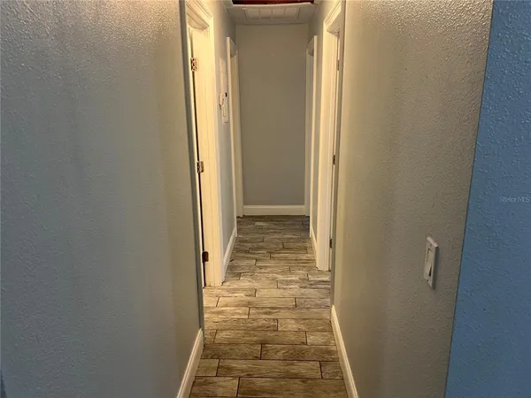 a view of a bathroom with white door