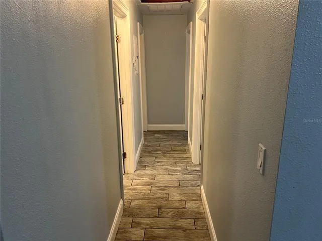a view of a bathroom with white door