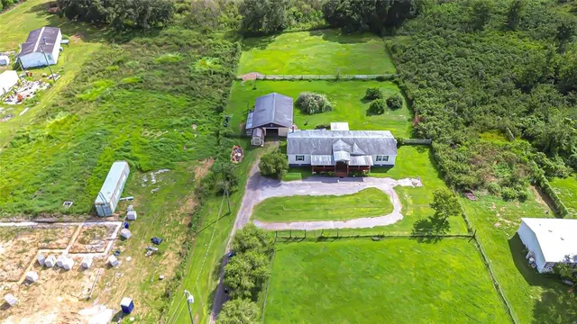 a view of a yard with swimming pool