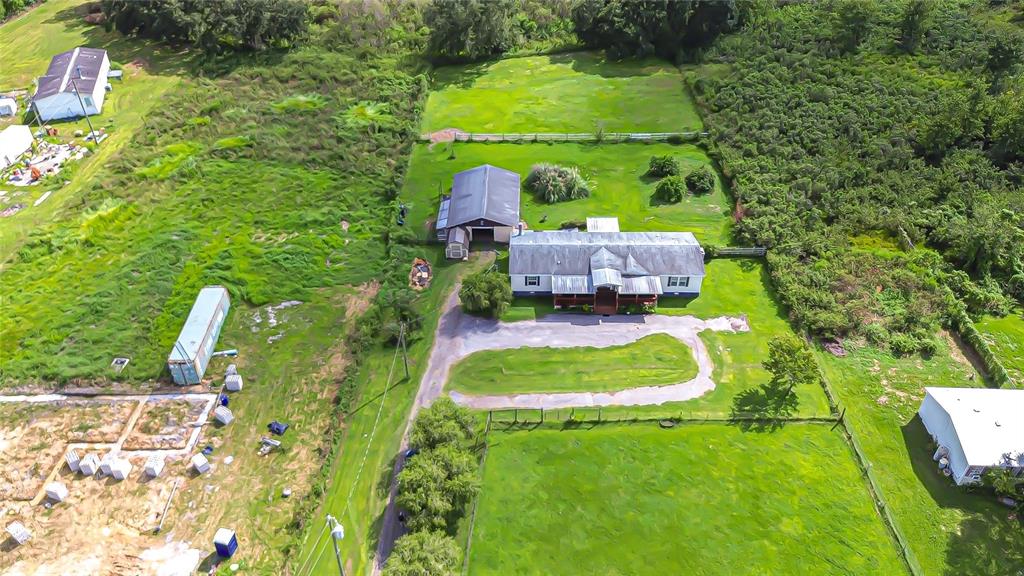 43650 County Road 54 East Kathleen, FL 33849 - Photo 2 of 72 a backyard of a house with a yard and outdoor seating
