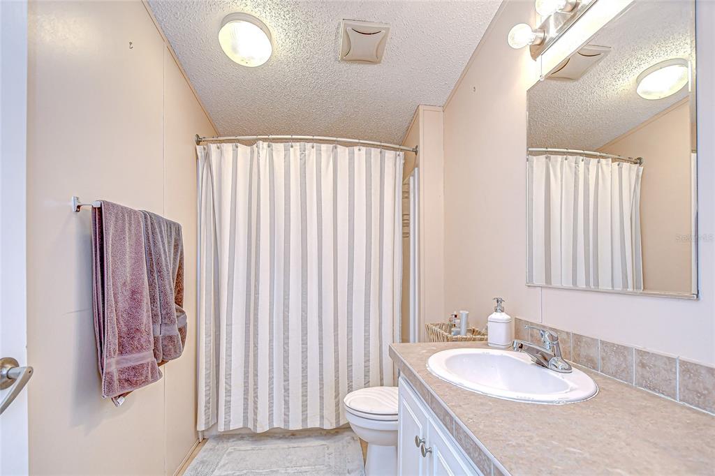 43650 County Road 54 East Kathleen, FL 33849 - Photo 32 of 72 a bathroom with a sink vanity granite and toilet