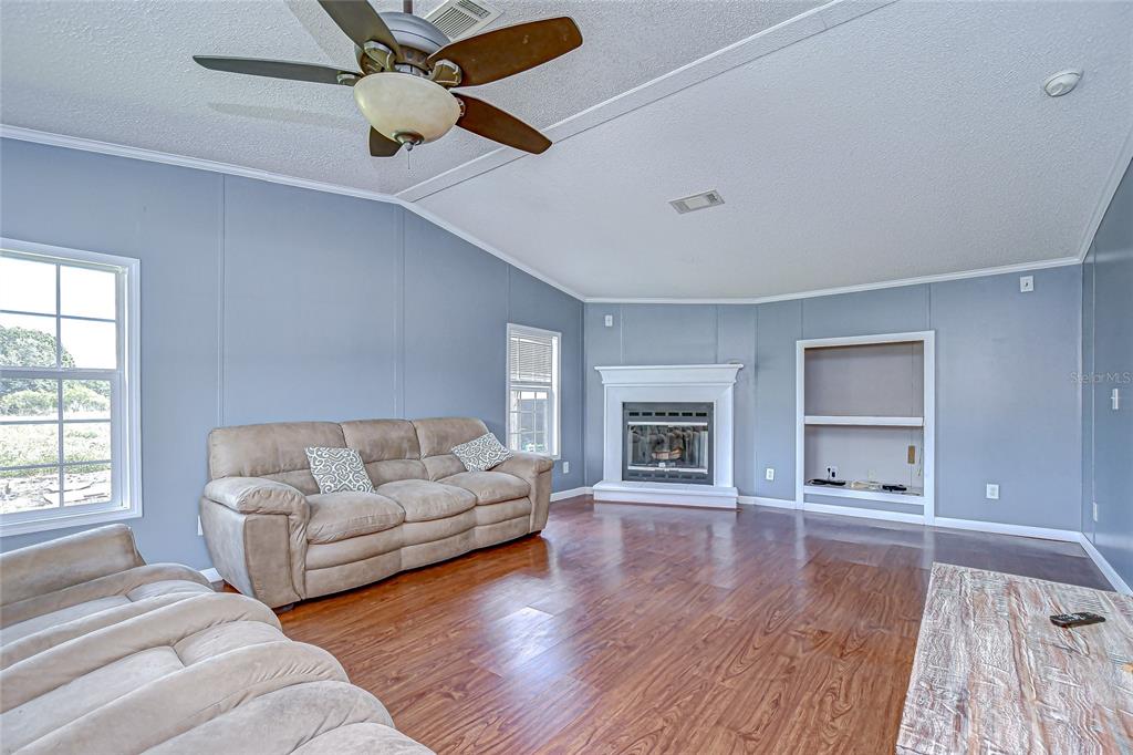 43650 County Road 54 East Kathleen, FL 33849 - Photo 34 of 72 a living room with furniture and a wooden floor