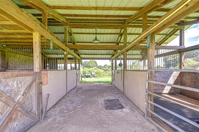 a view of yard with swimming pool and green space