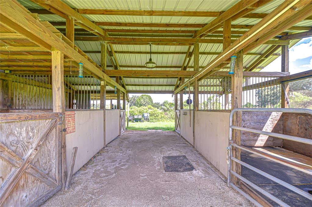 43650 County Road 54 East Kathleen, FL 33849 - Photo 38 of 72 a view of backyard with porch and wooden floor