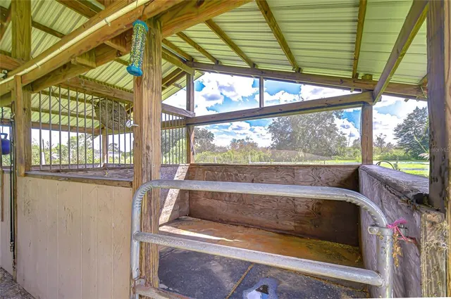a view of a swimming pool with a yard