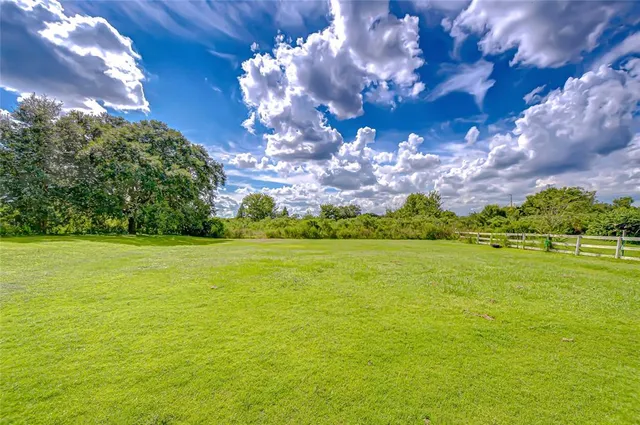 a front view of a house with a porch and a yard