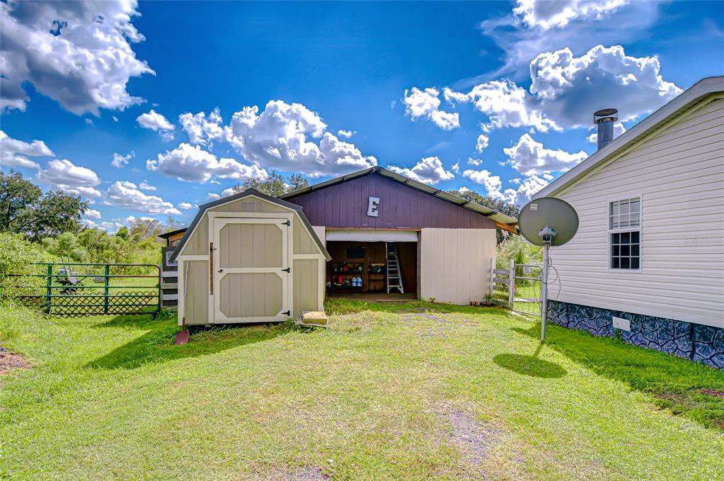 43650 County Road 54 East Kathleen, FL 33849 - Photo 70 of 72 a view of a house with a yard and a large tree
