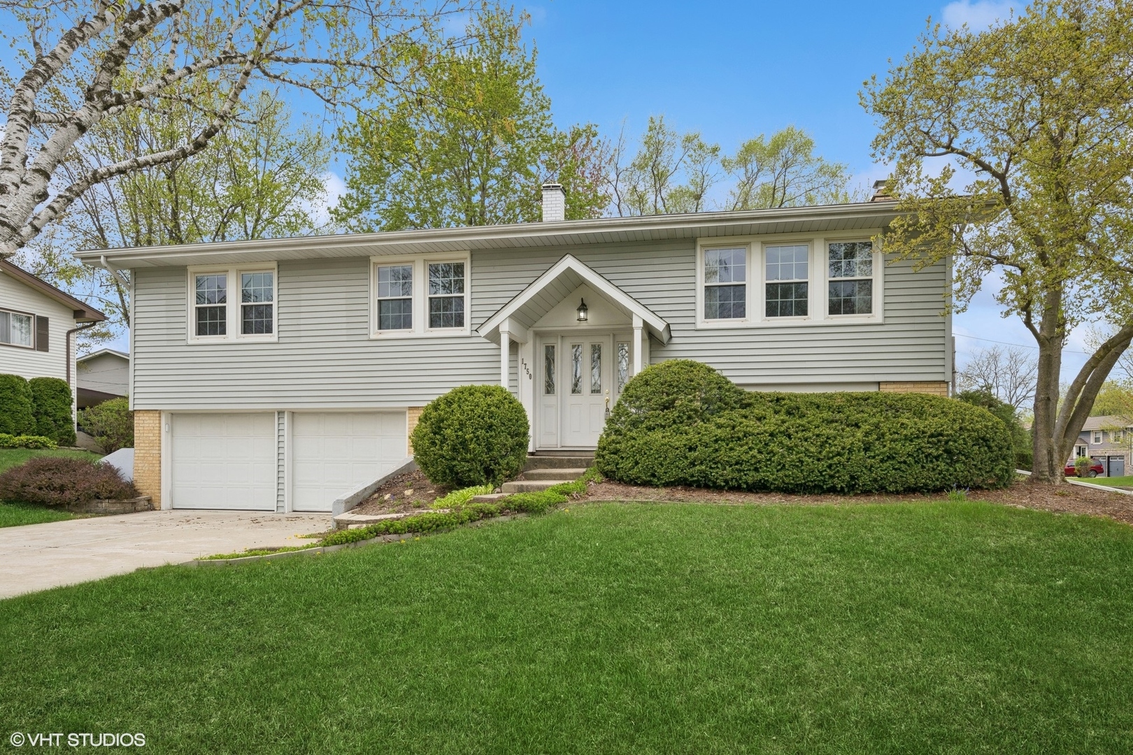 1750 Chippendale Road Hoffman Estates, IL 60169 - Photo 2 of 19 a view of an house with backyard space and garden