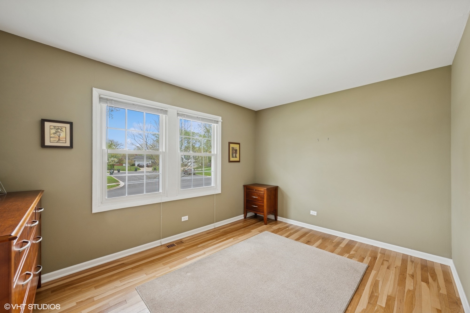 1750 Chippendale Road Hoffman Estates, IL 60169 - Photo 7 of 19 a bedroom with a bed and a window