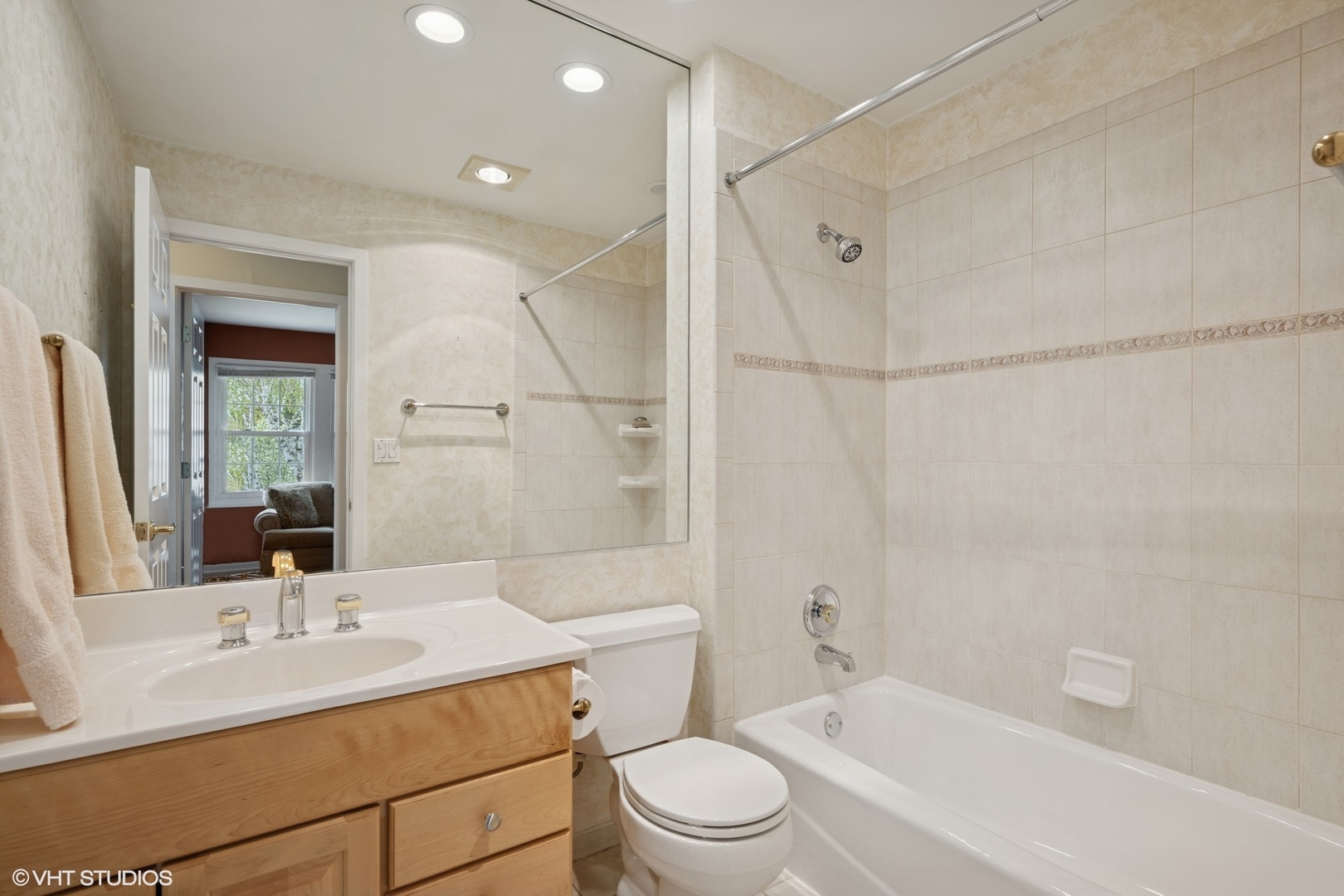 1750 Chippendale Road Hoffman Estates, IL 60169 - Photo 10 of 19 a bathroom with a sink toilet vanity and shower