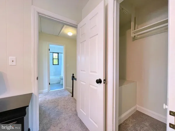 a view of a bathroom with a glass door and shower