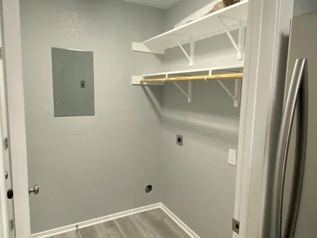 a bathroom with a glass shower door