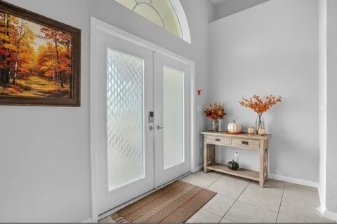 a kitchen with stainless steel appliances granite countertop a refrigerator sink and stove