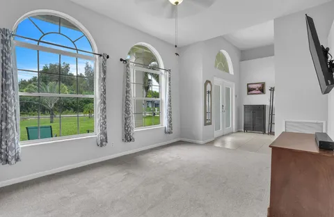 a view of a dining room with furniture window and outside view