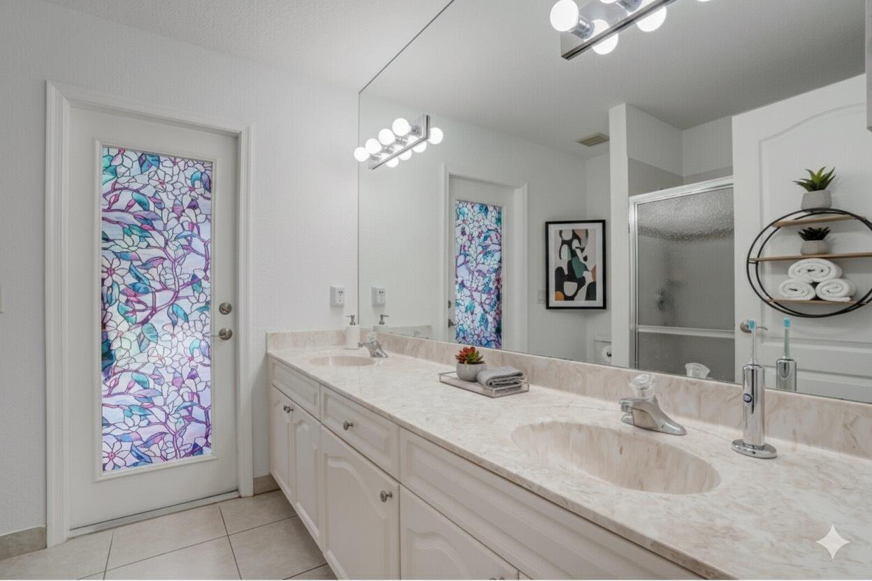 13218 86th Road North The Acreage, FL 33412 - Photo 54 of 69 a bathroom with double vanity sinks a vanity and a mirror