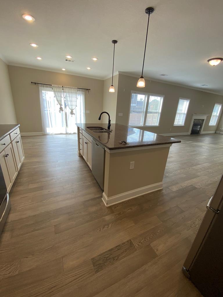 4862 Charleston Way Midland, GA 31820 - Photo 3 of 4 a view of a living room and kitchen with a large window