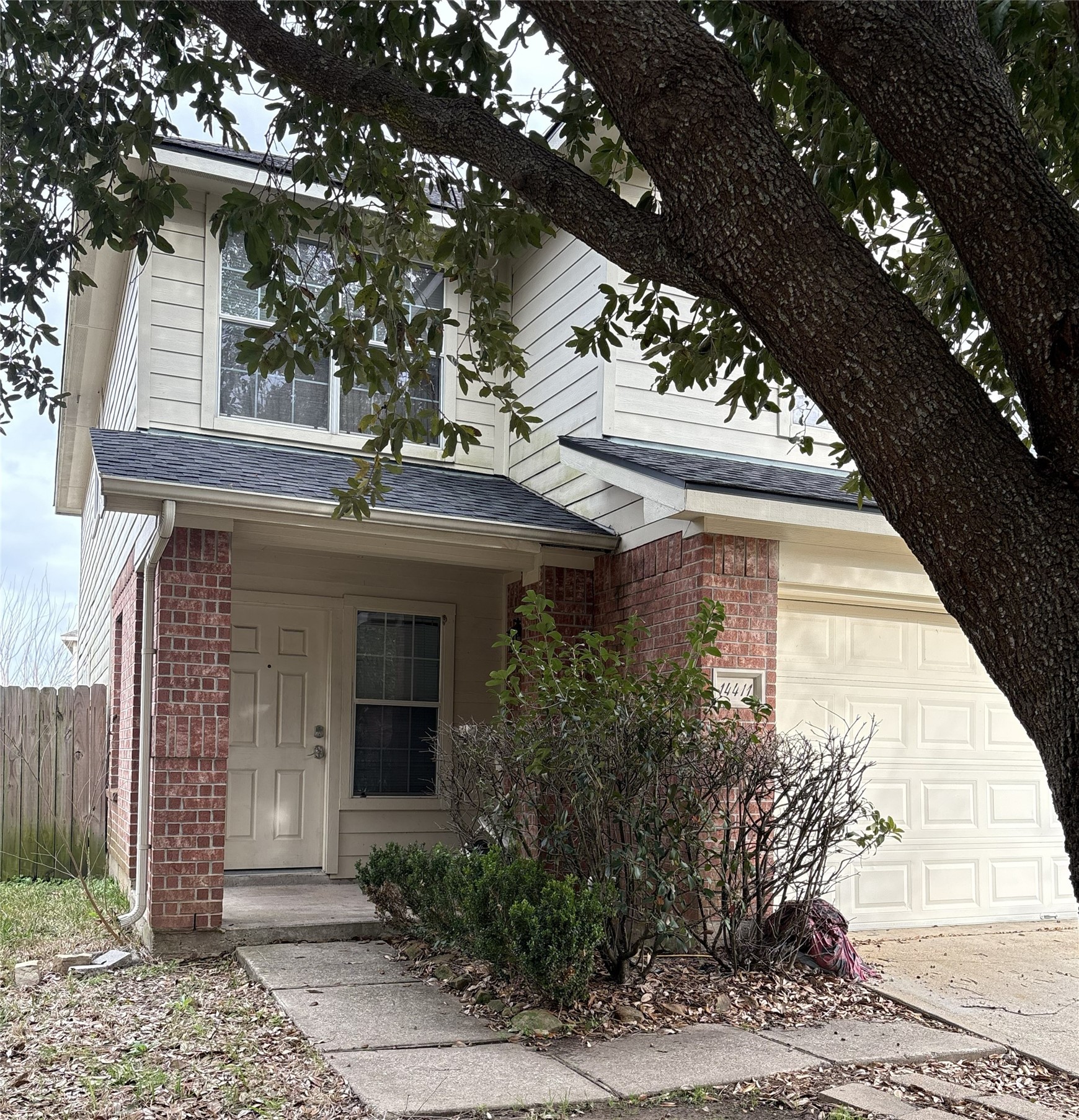 14411 Brunswick Point Lane Houston, TX 77047 - Photo 2 of 7 a view of a house with a tree