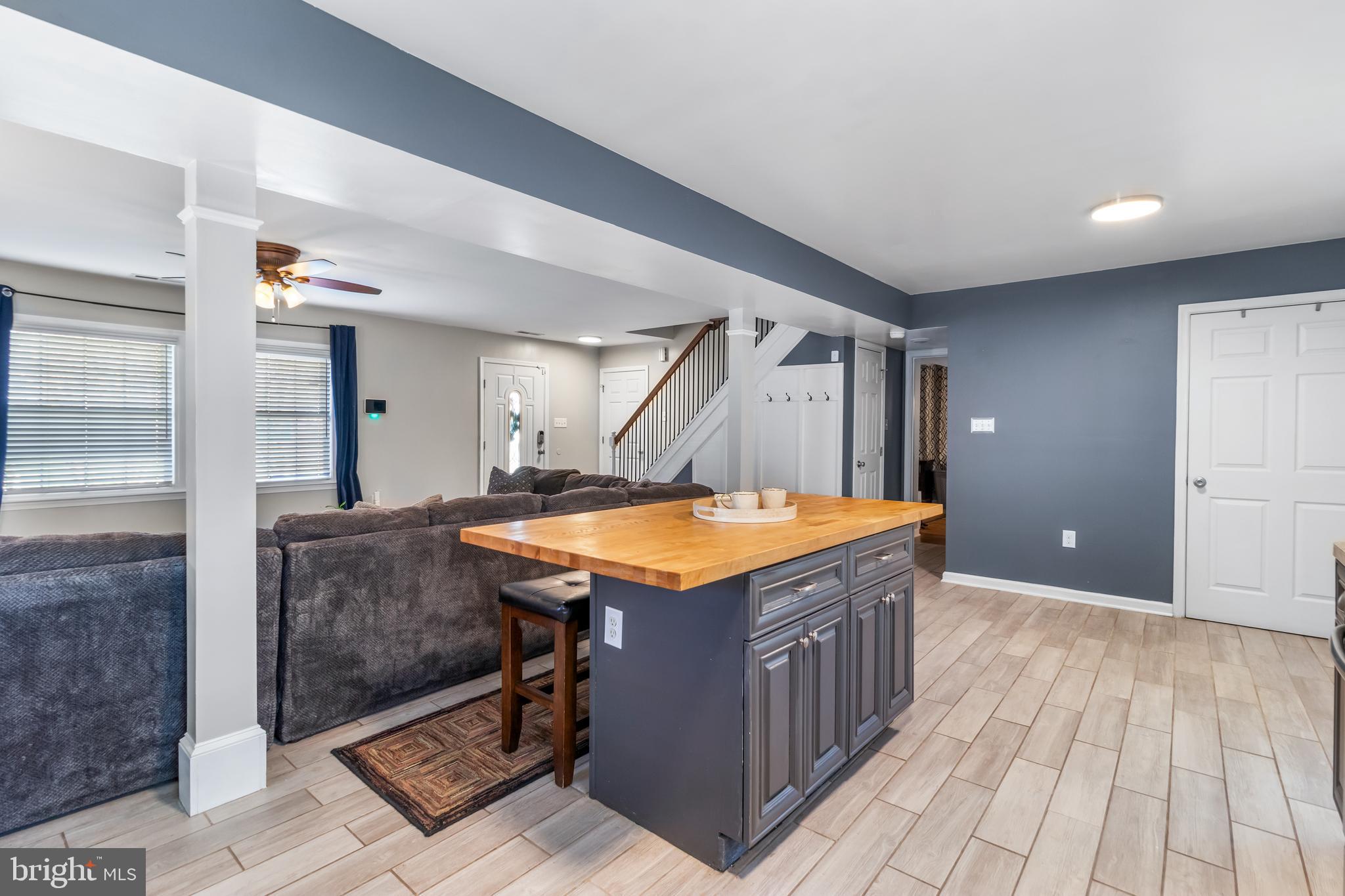 22 Marshall Road Waldorf, MD 20602 - Photo 11 of 41 a kitchen with a stove and a wooden floor