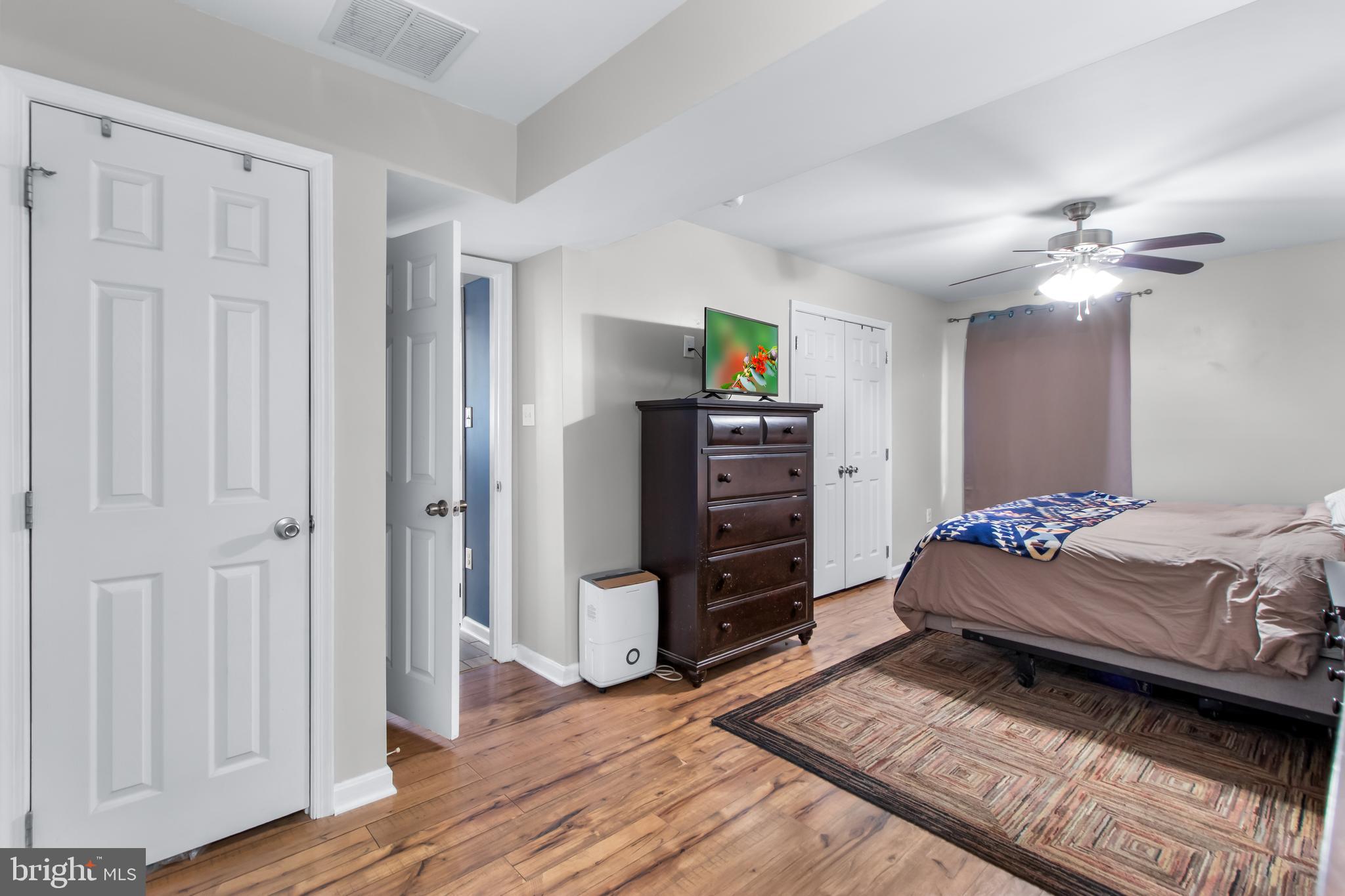 22 Marshall Road Waldorf, MD 20602 - Photo 18 of 41 a bedroom with a bed and a chandelier