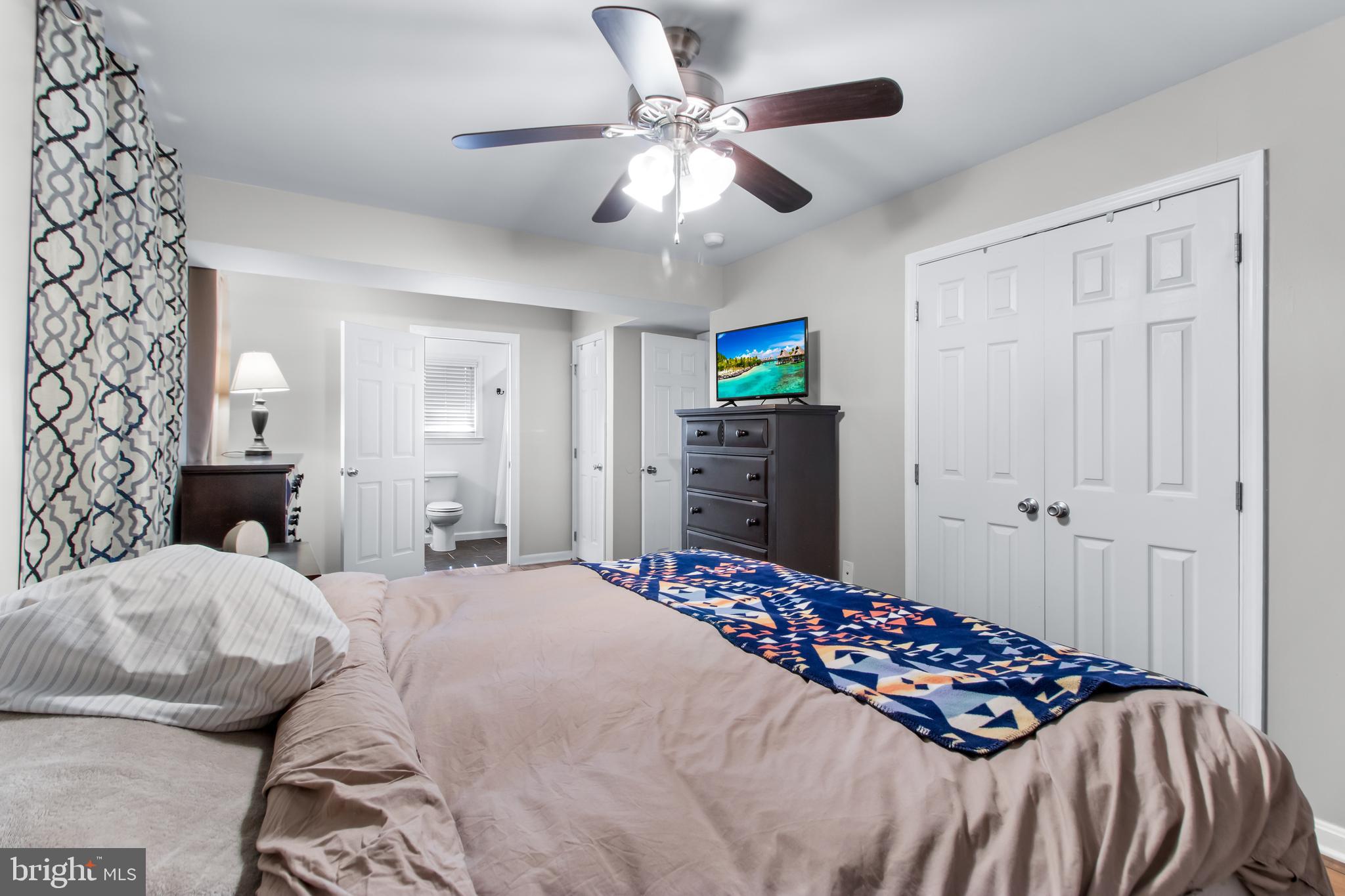 22 Marshall Road Waldorf, MD 20602 - Photo 19 of 41 a bedroom with a bed and a chandelier