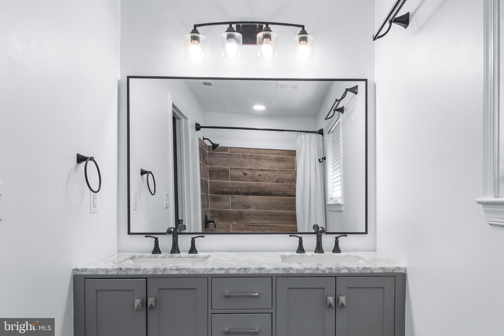 22 Marshall Road Waldorf, MD 20602 - Photo 20 of 41 a bathroom with a granite countertop sink and a mirror