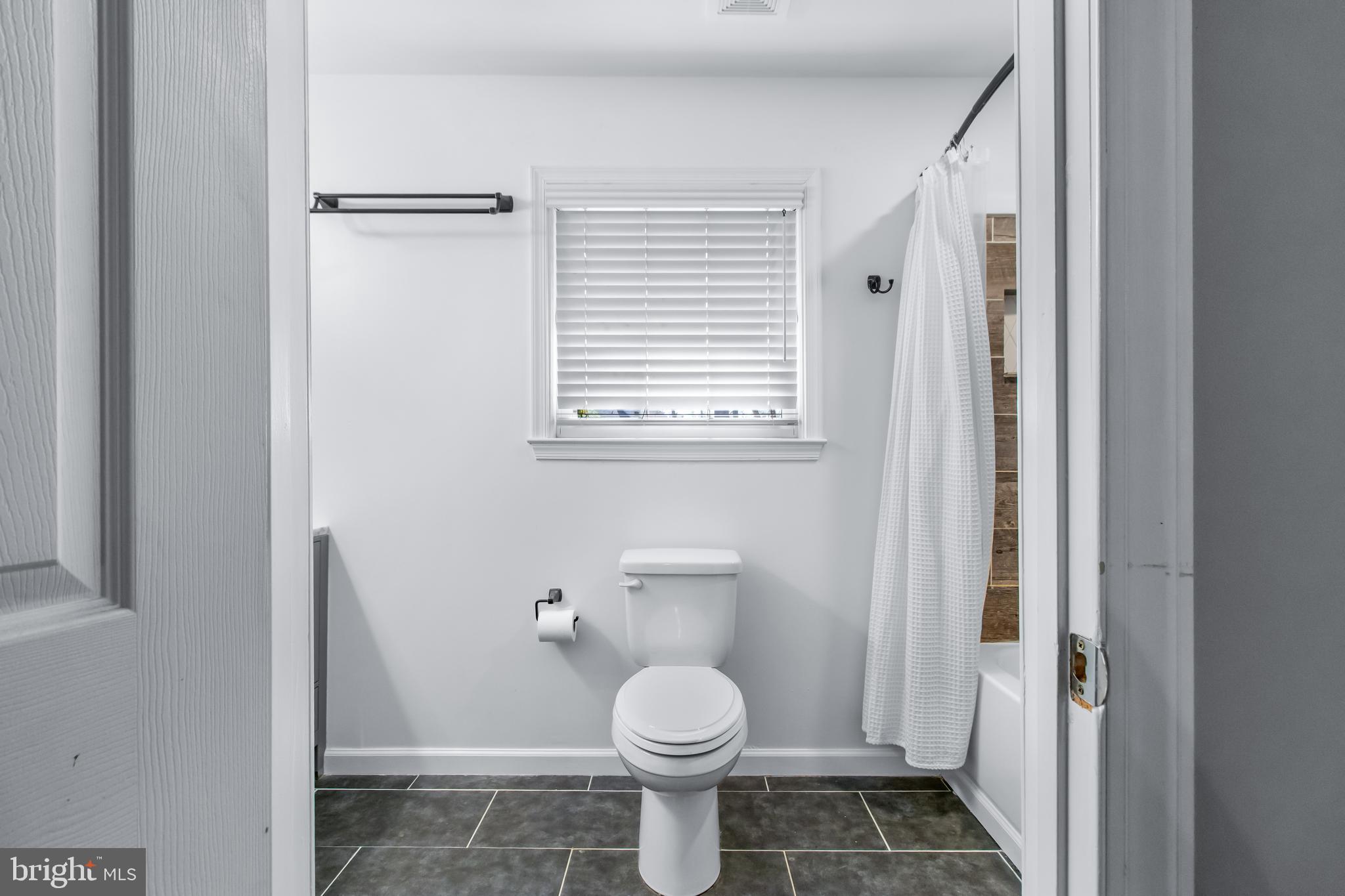 22 Marshall Road Waldorf, MD 20602 - Photo 21 of 38 a bathroom with a toilet and a shower