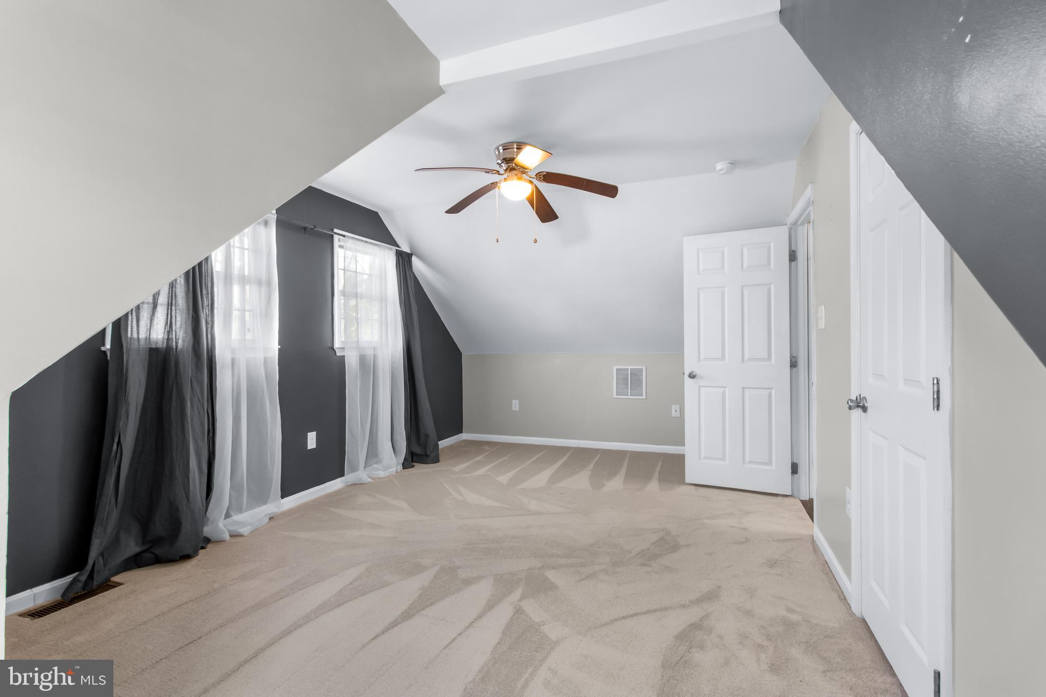 22 Marshall Road Waldorf, MD 20602 - Photo 27 of 38 an empty room with closet and a chandelier fan