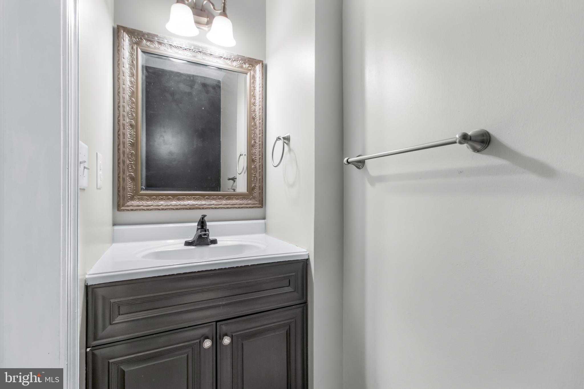 22 Marshall Road Waldorf, MD 20602 - Photo 34 of 41 a bathroom with a sink and a mirror