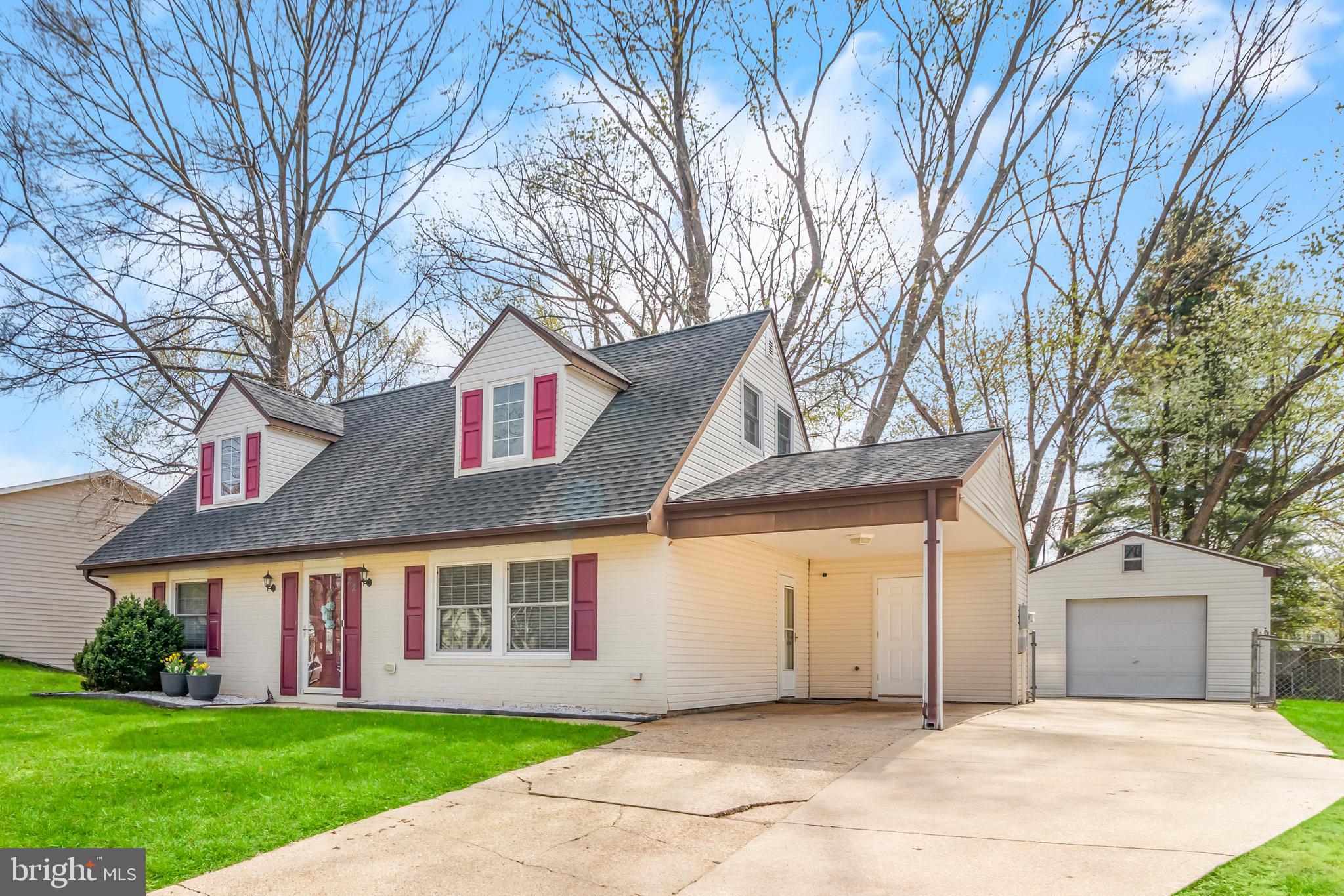 22 Marshall Road Waldorf, MD 20602 - Photo 4 of 41 a front view of a house with a yard and garage