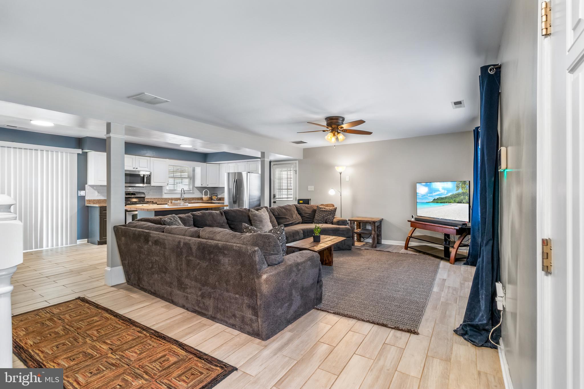 22 Marshall Road Waldorf, MD 20602 - Photo 8 of 41 a living room with furniture and a flat screen tv