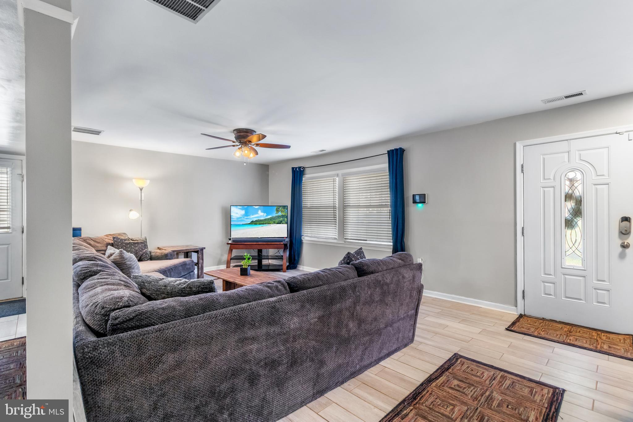 22 Marshall Road Waldorf, MD 20602 - Photo 9 of 41 a living room with furniture and a flat screen tv