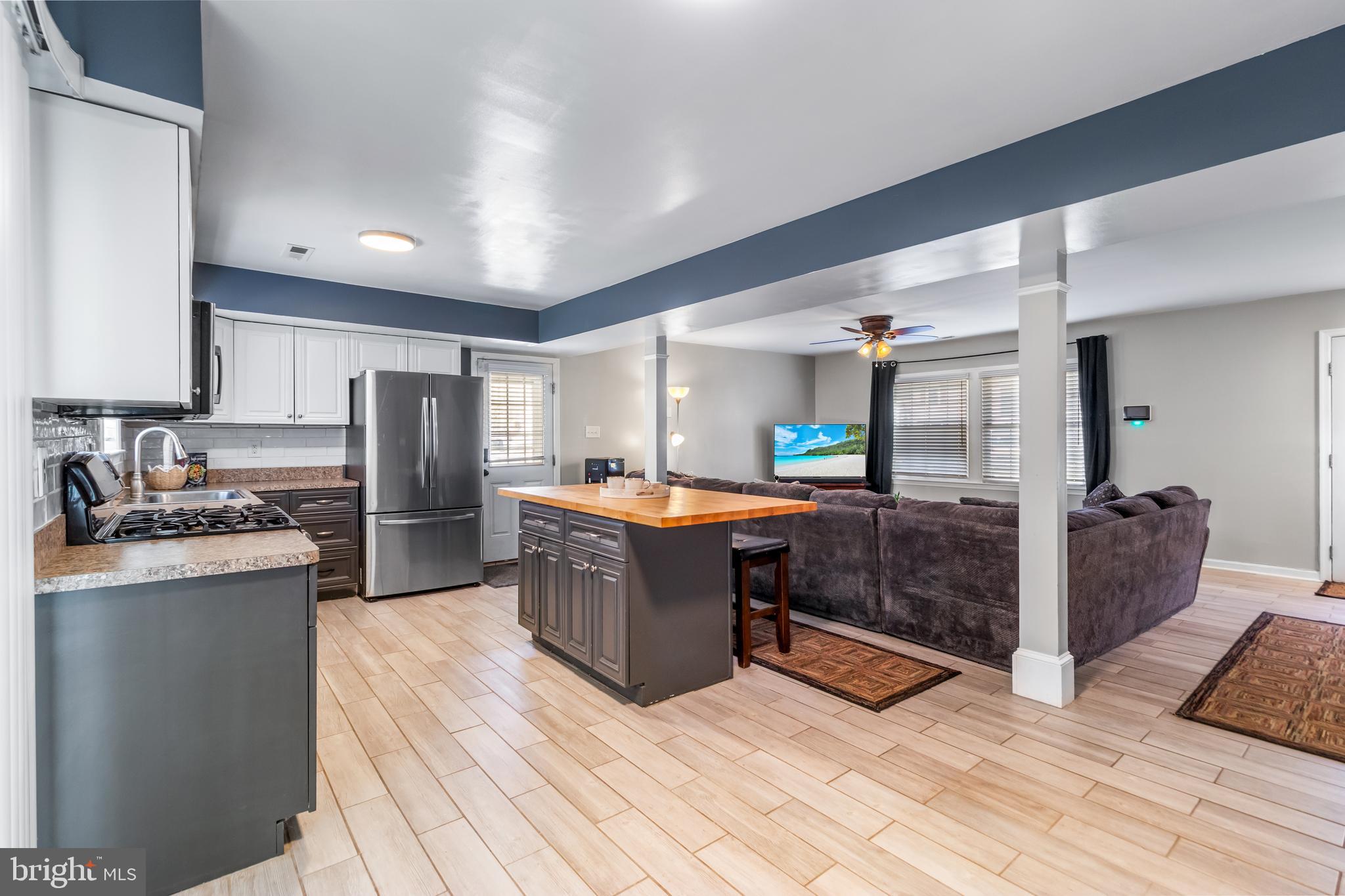22 Marshall Road Waldorf, MD 20602 - Photo 10 of 41 a kitchen with stainless steel appliances kitchen island granite countertop a refrigerator a stove top oven and a sink