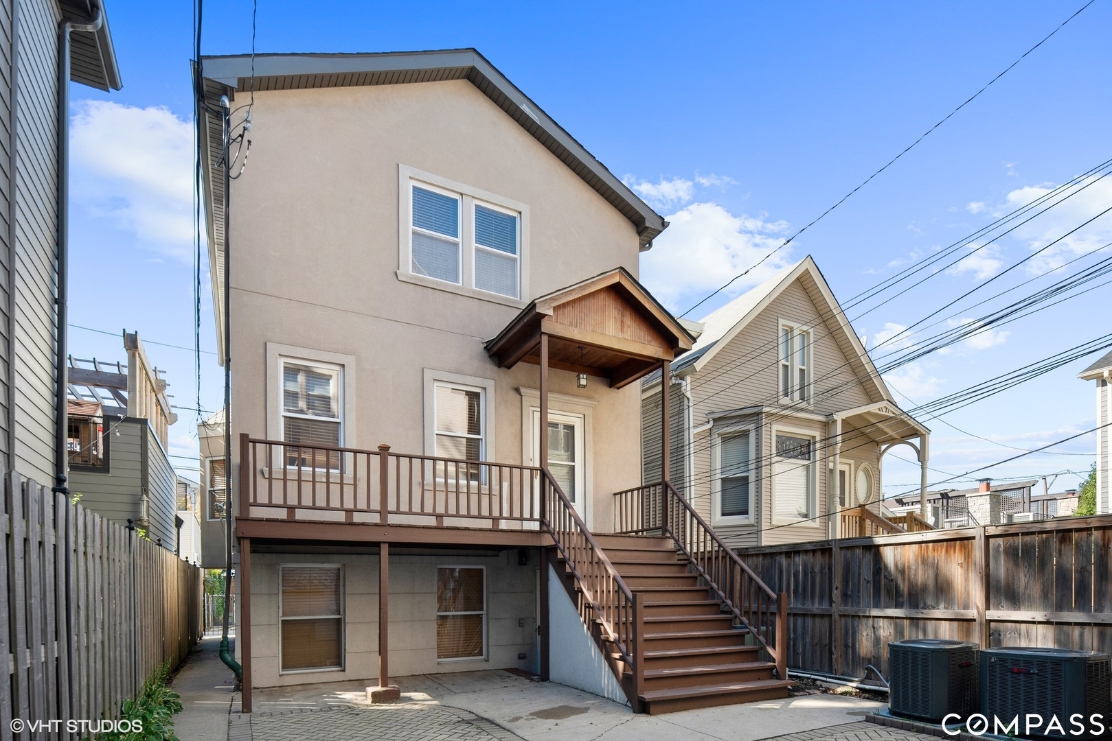 a view of a house with wooden deck