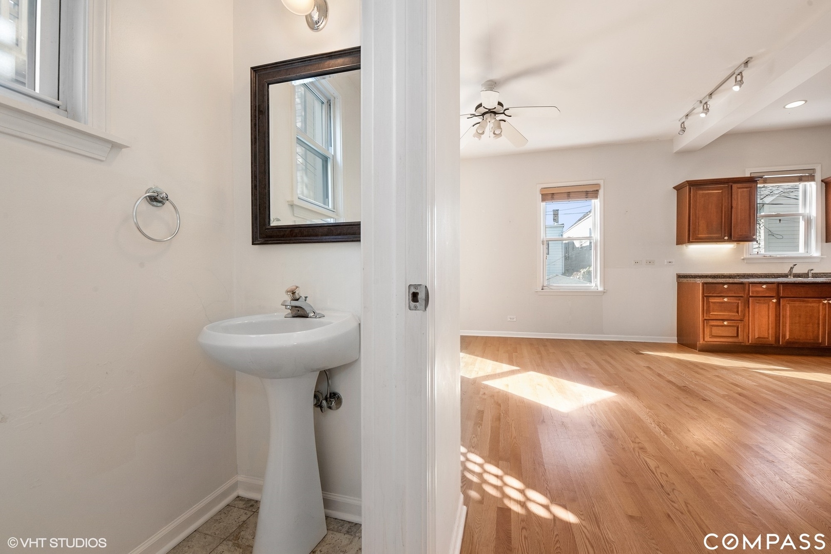 3304 North Hamilton Avenue, Unit R Chicago, IL 60618 - Photo 5 of 18 a bathroom with a sink and a mirror