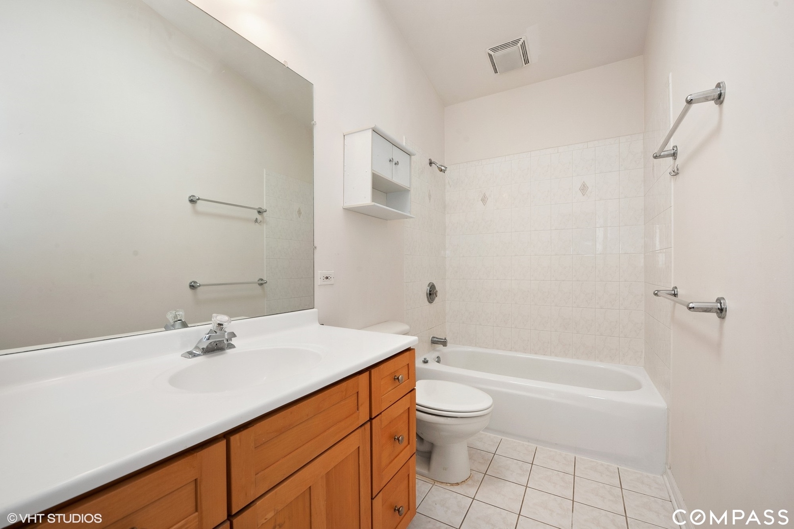 3304 North Hamilton Avenue, Unit R Chicago, IL 60618 - Photo 9 of 18 a bathroom with a sink a toilet and shower