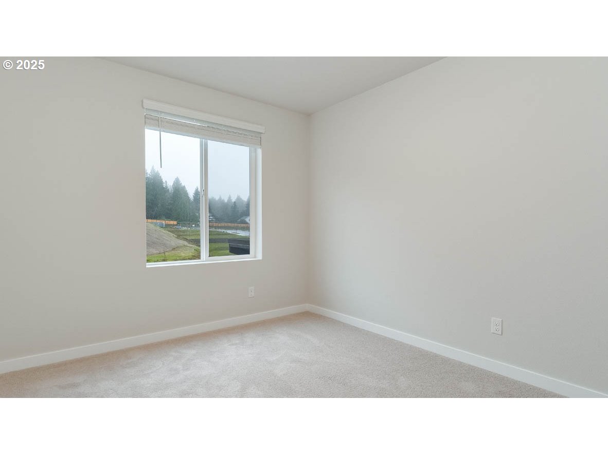 9463 Southeast Crystal Rose Street Happy Valley, OR 97086 - Photo 14 of 27 a black and white photo of a living room
