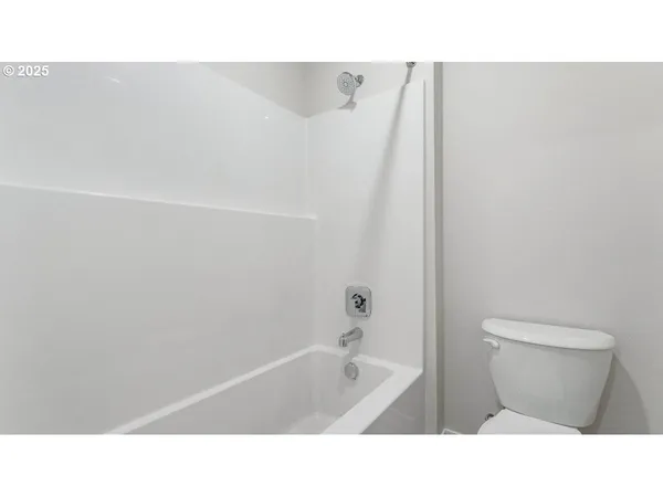a bathroom with a sink a toilet and bathtub