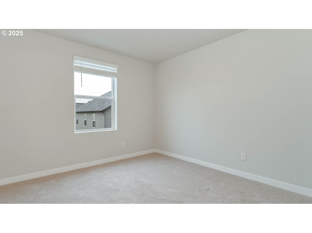 9463 Southeast Crystal Rose Street Happy Valley, OR 97086 - Photo 18 of 27 a open area with window