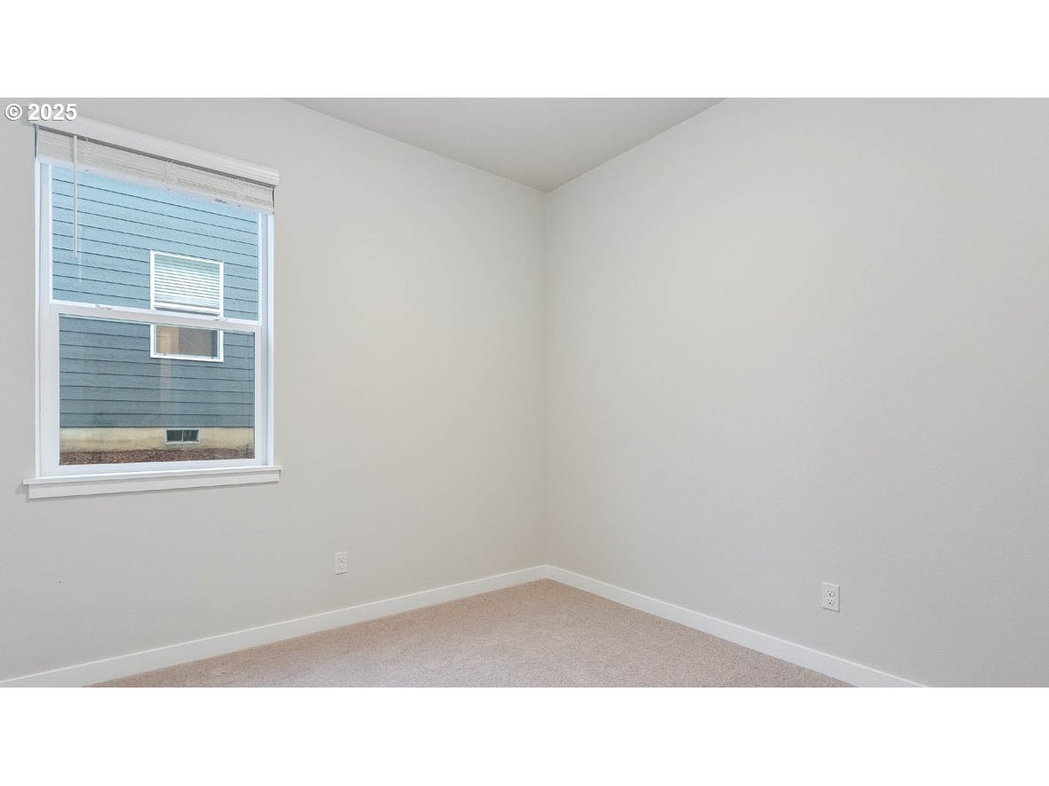 9463 Southeast Crystal Rose Street Happy Valley, OR 97086 - Photo 4 of 27 a black and white photo of a room