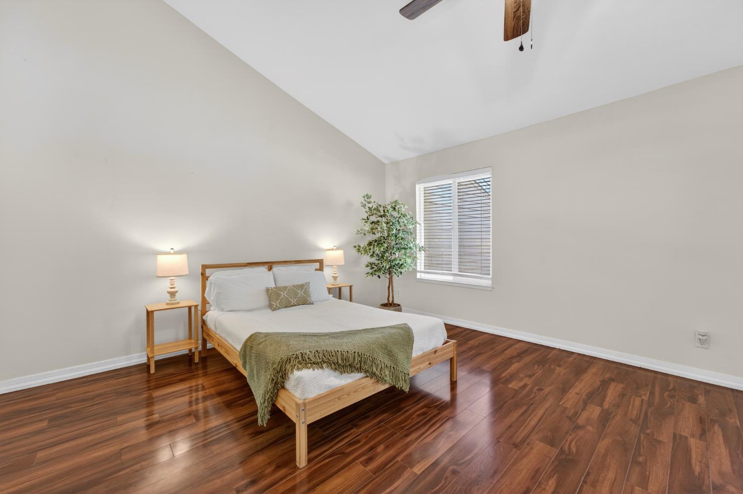6146 Shadow Lane Citrus Heights, CA 95621 - Photo 17 of 45 a bedroom with a bed and wooden floor