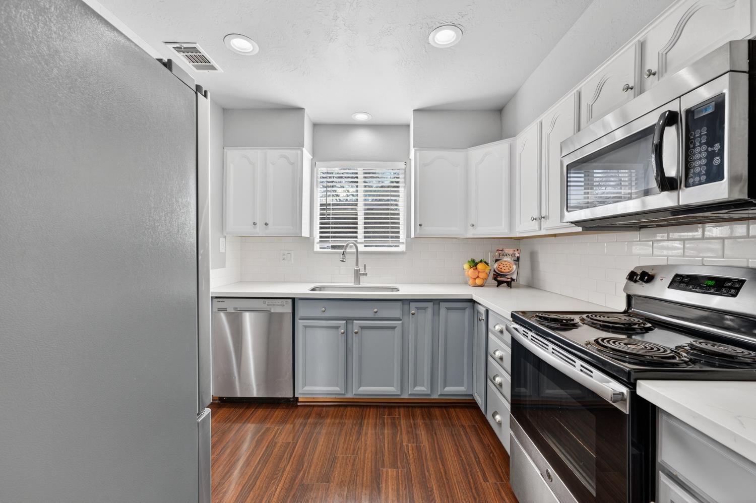 6146 Shadow Lane Citrus Heights, CA 95621 - Photo 7 of 45 a kitchen with stainless steel appliances granite countertop a stove and a microwave