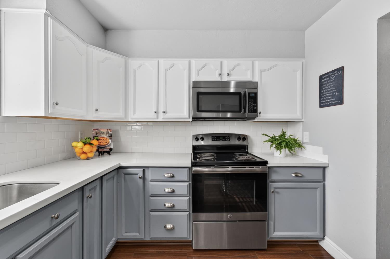 6146 Shadow Lane Citrus Heights, CA 95621 - Photo 8 of 45 a kitchen with stainless steel appliances a stove a microwave a sink and cabinets
