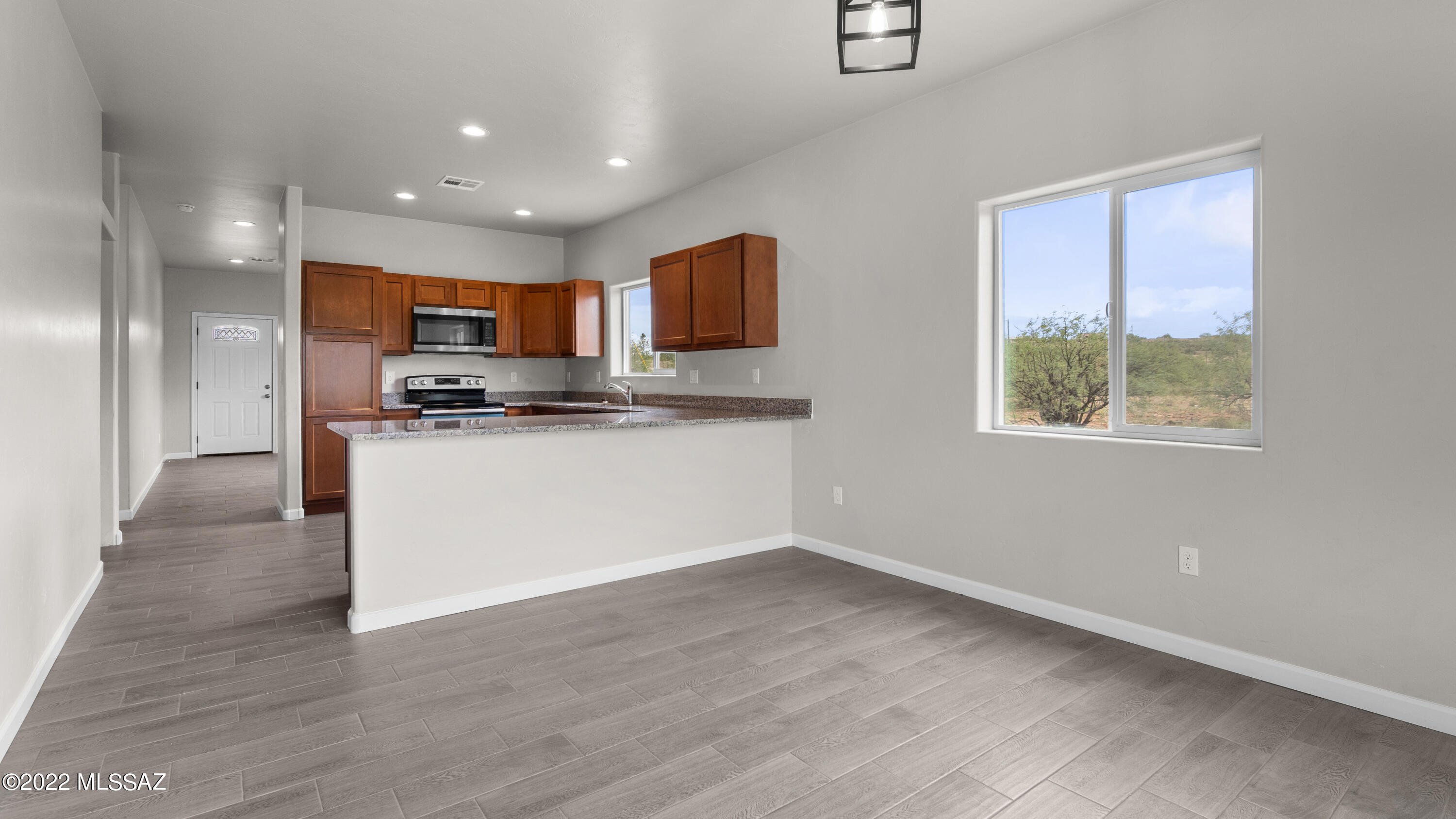 1843 Calle Mulata Rio Rico, AZ 85648 - Photo 22 of 27 a view of kitchen with stainless steel appliances granite countertop a stove a sink and a microwave