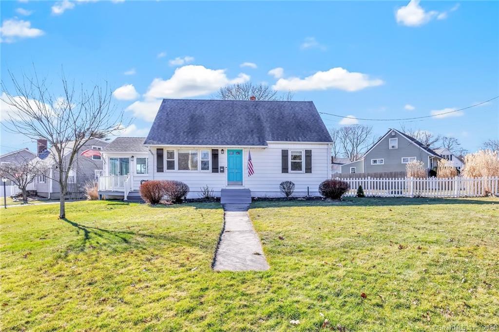 a front view of house with yard and swimming pool
