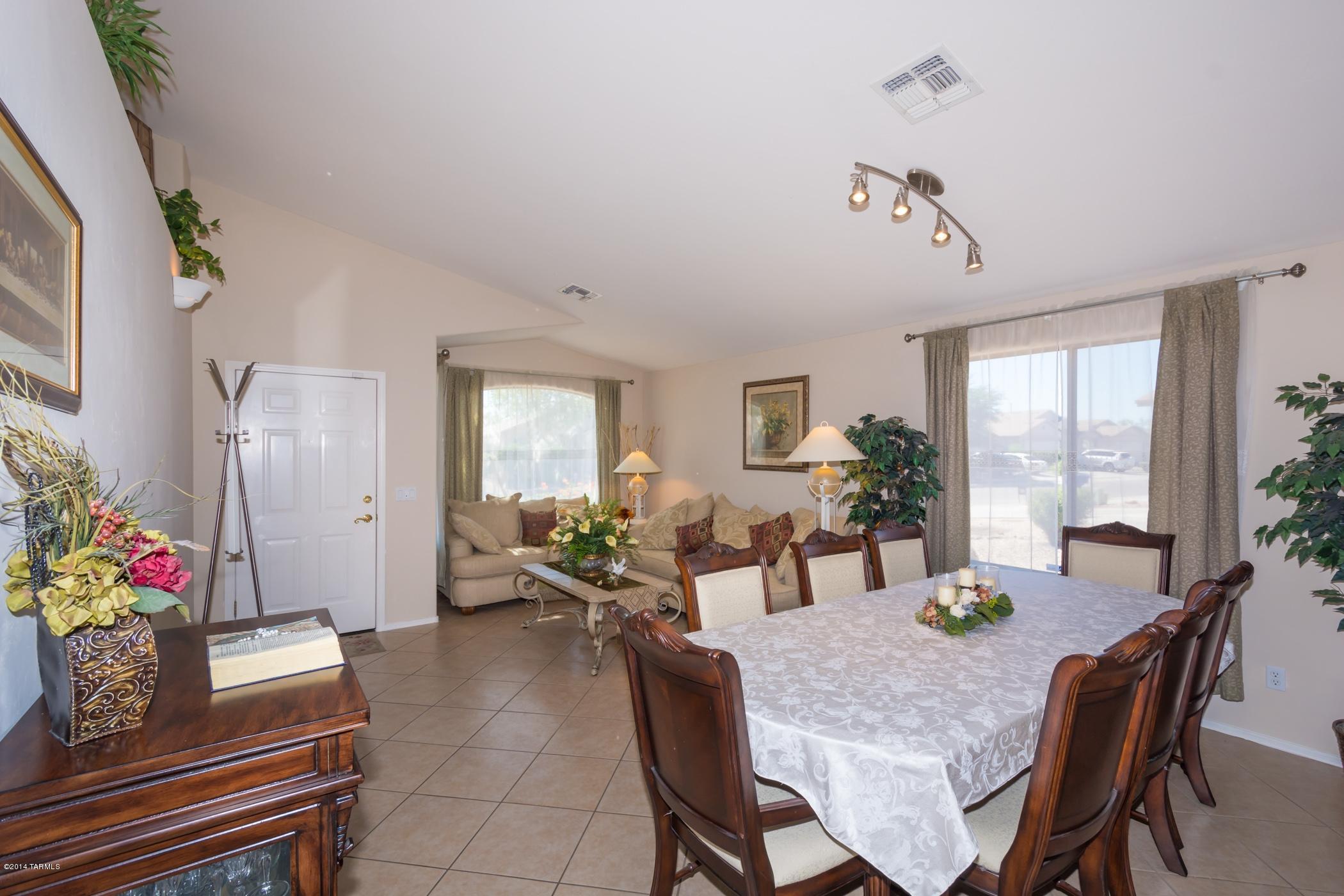 4648 South Valley Road Tucson, AZ 85714 - Photo 4 of 30 a view of a dining room with furniture window and wooden floor
