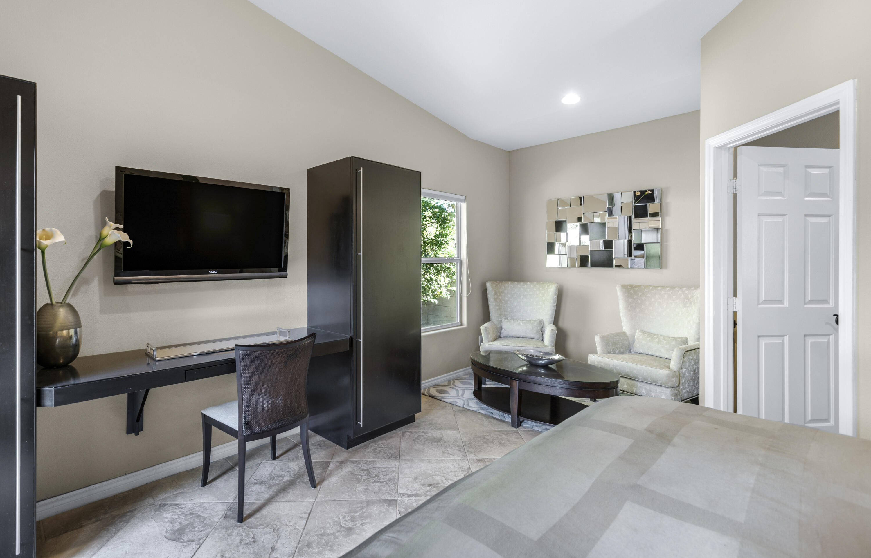 68590 Risueno Road Cathedral City, CA 92234 - Photo 33 of 72 a living room with furniture and a flat screen tv