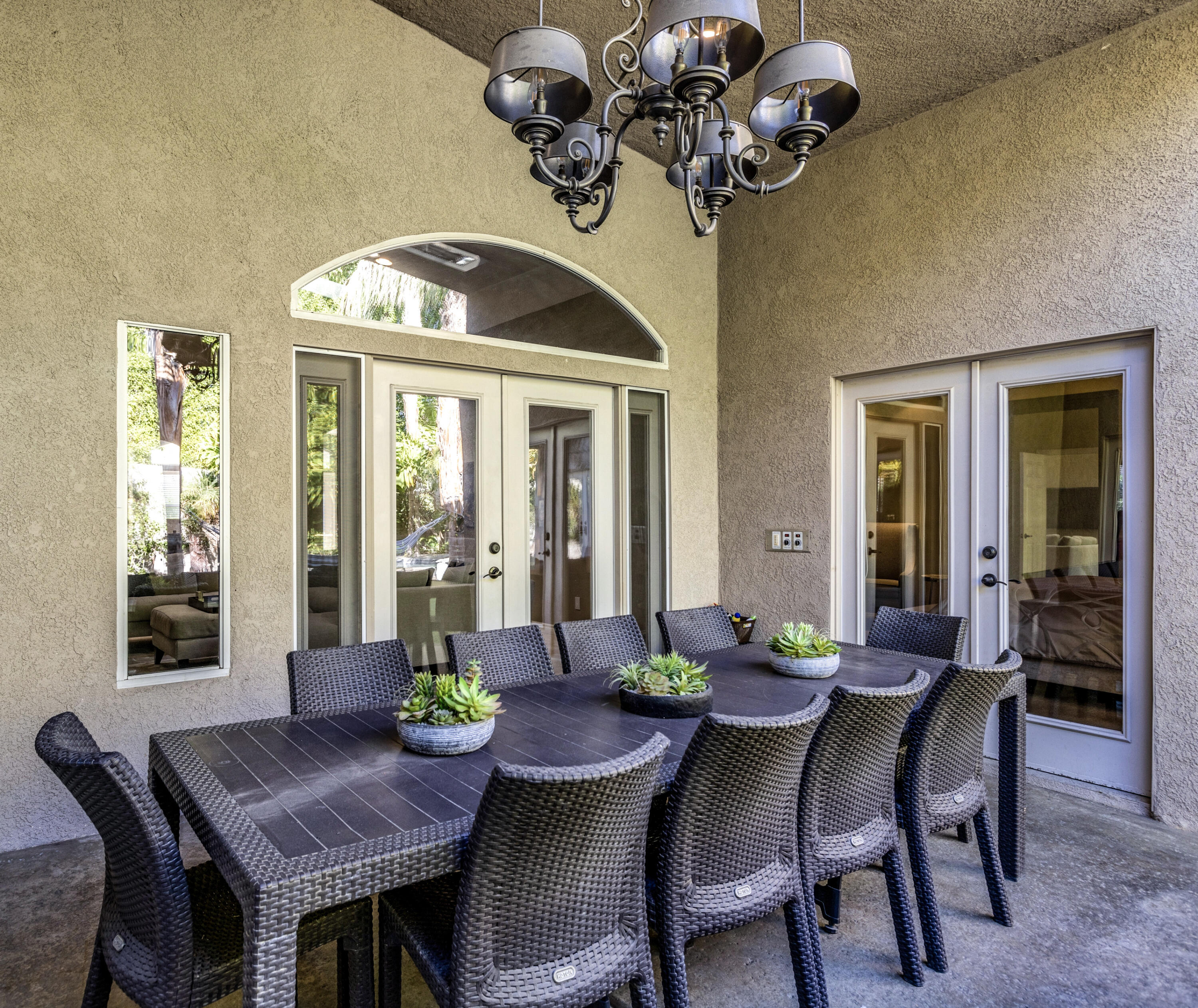 68590 Risueno Road Cathedral City, CA 92234 - Photo 39 of 72 a view of a dining room with furniture wooden floor and chandelier