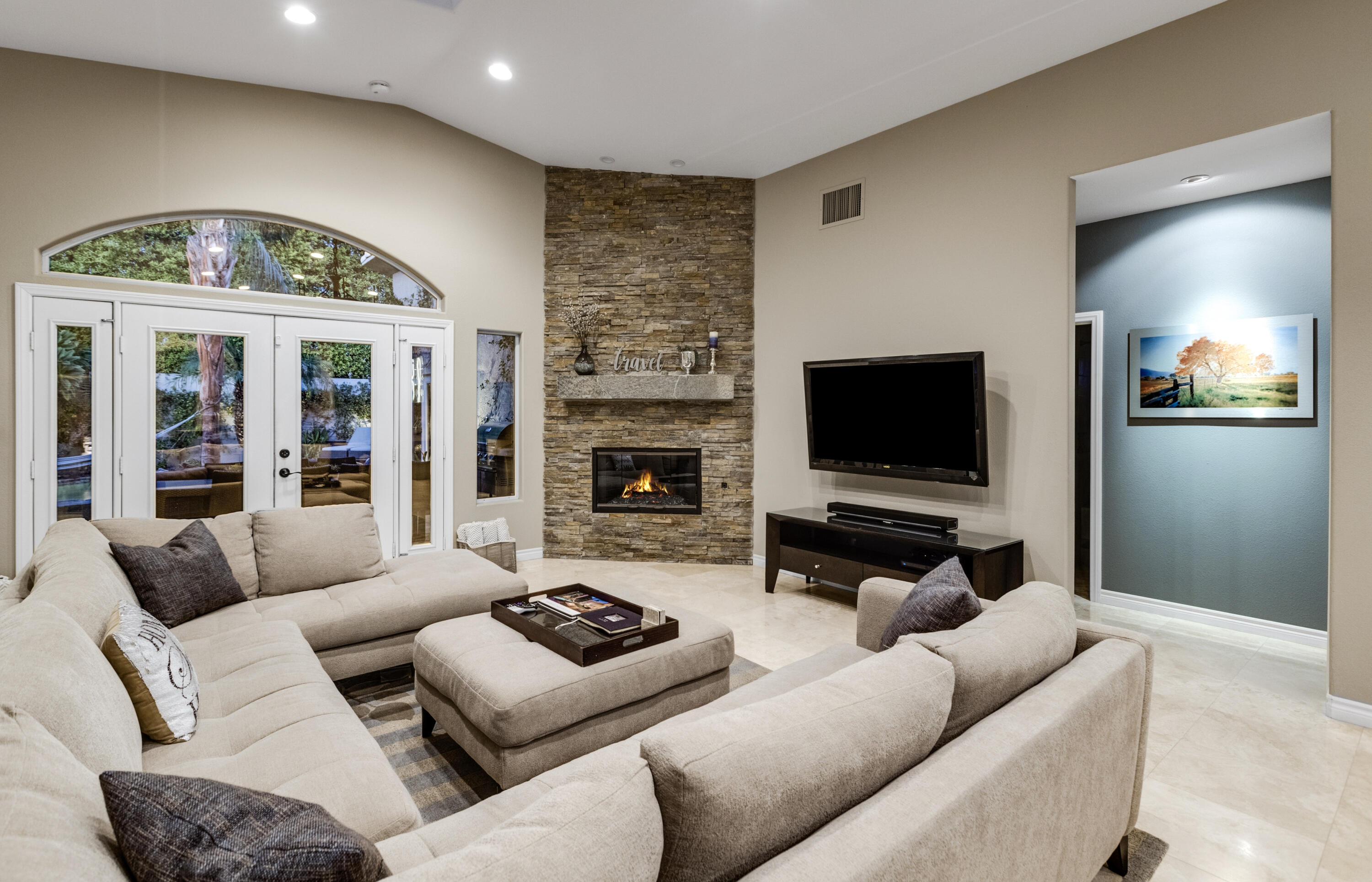 68590 Risueno Road Cathedral City, CA 92234 - Photo 61 of 72 a living room with furniture flat screen tv and a fireplace